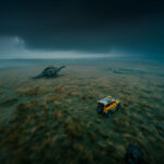 adrianrohnfelder_drone_shot_of_stegosaurus_and_a_yellow_landrov_25a8256f-ee6f-4cad-95a5-006042ffd2f1